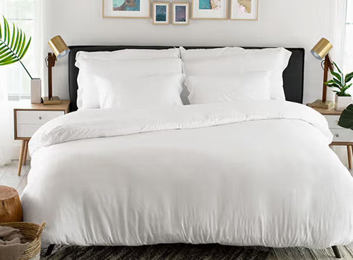 bed with white duvet cover