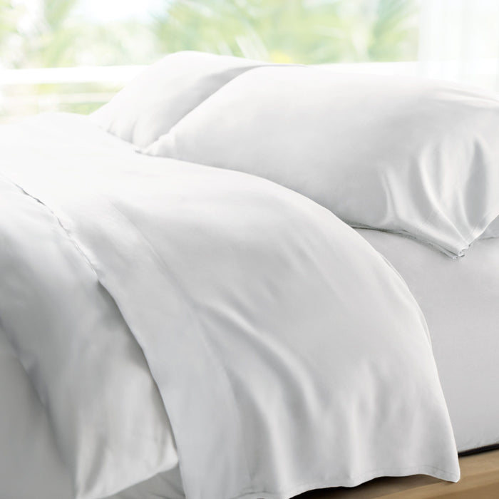 bed made with white retreat sheets