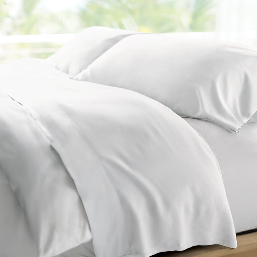 bed made with white retreat sheets