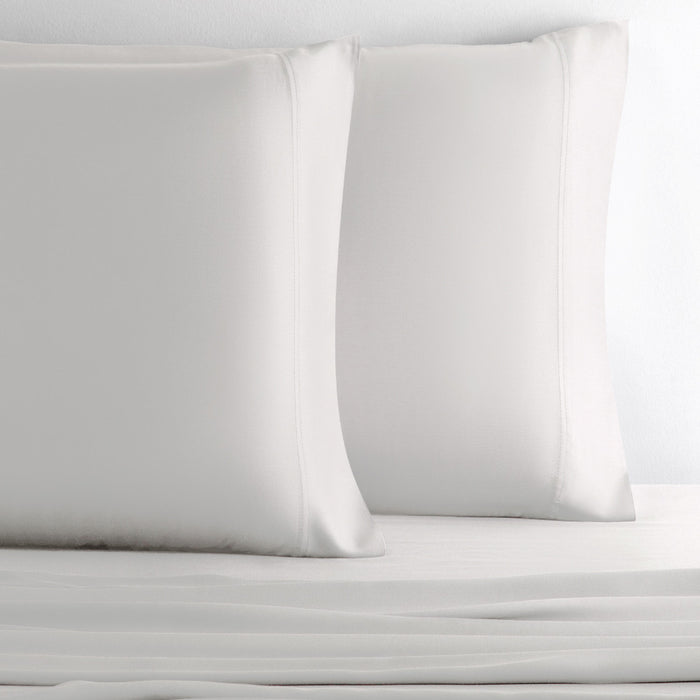 two pillows with black sand pillowcases