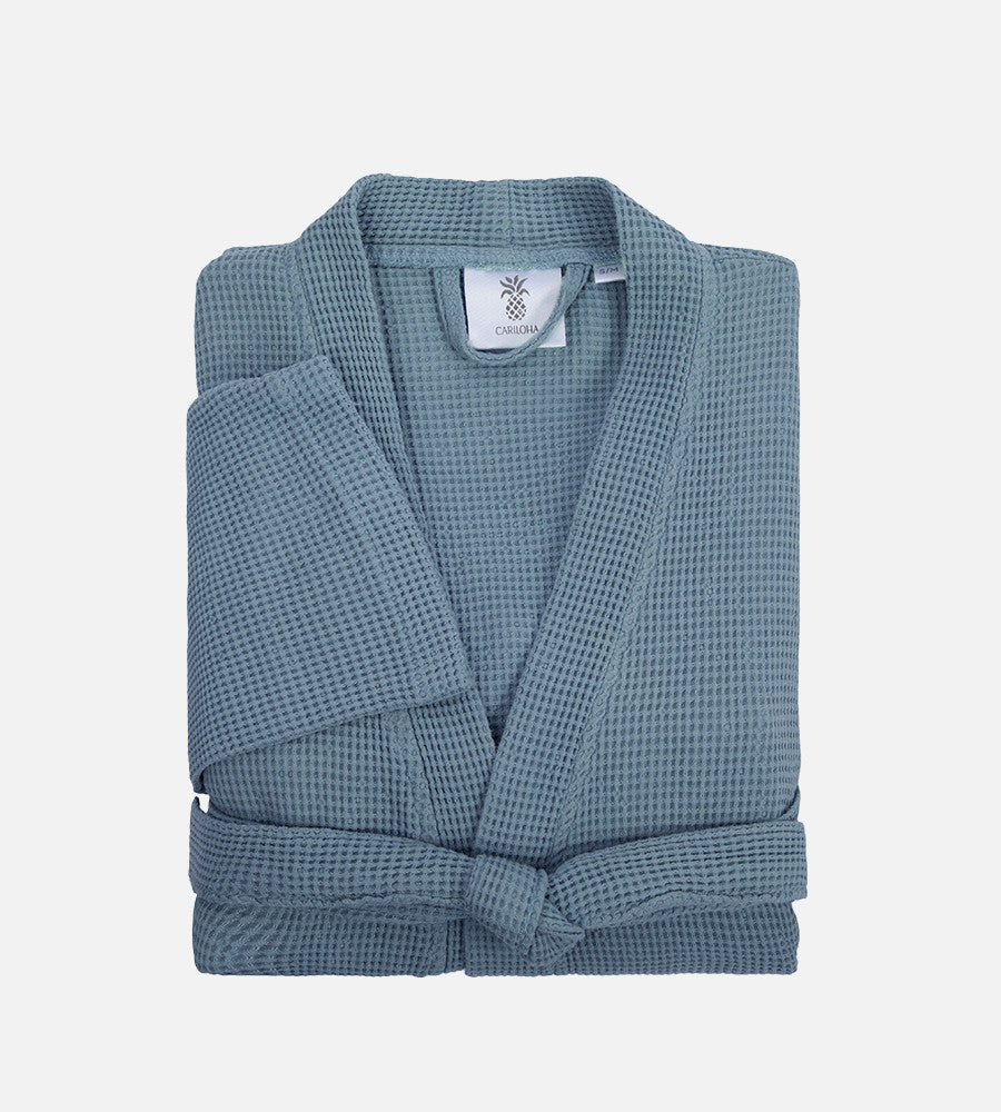 folded up marine blue waffle knit robe