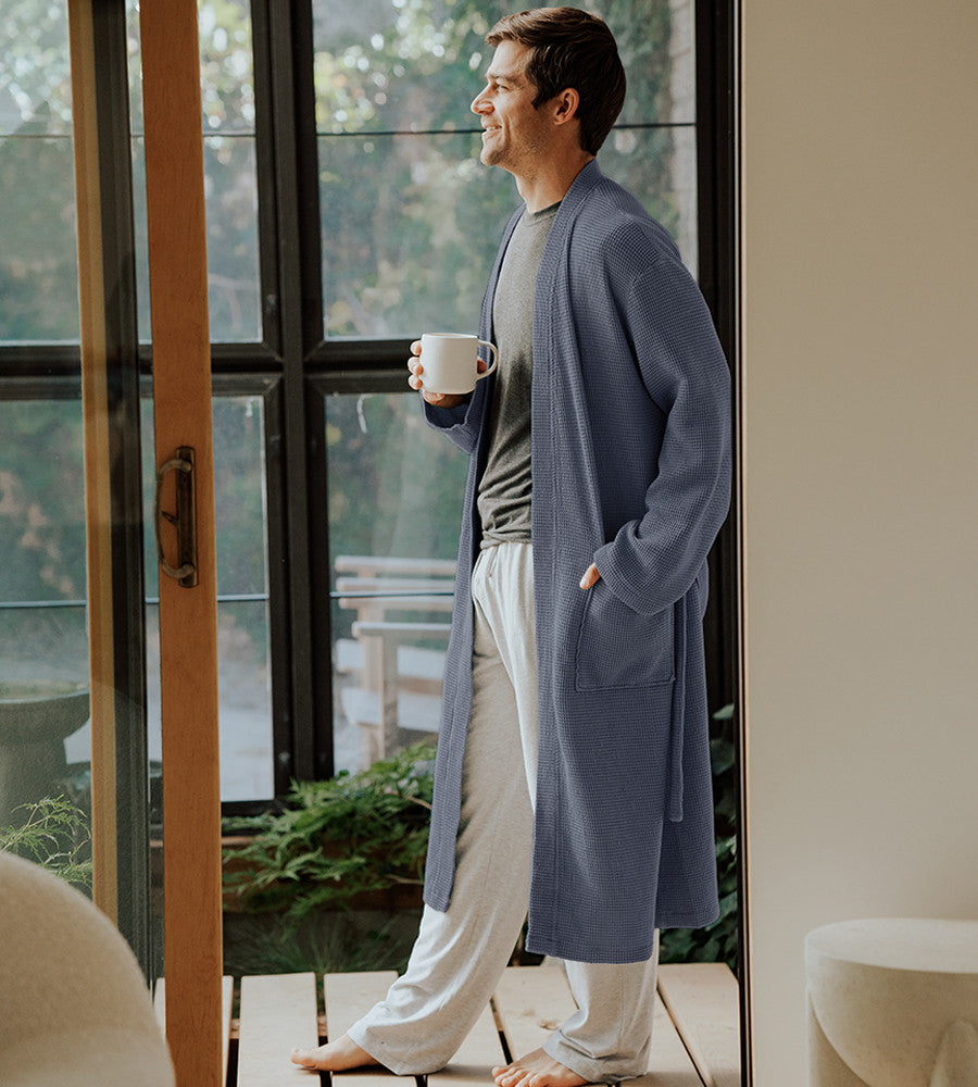 side view of model wearing marine blue waffle knit robe~