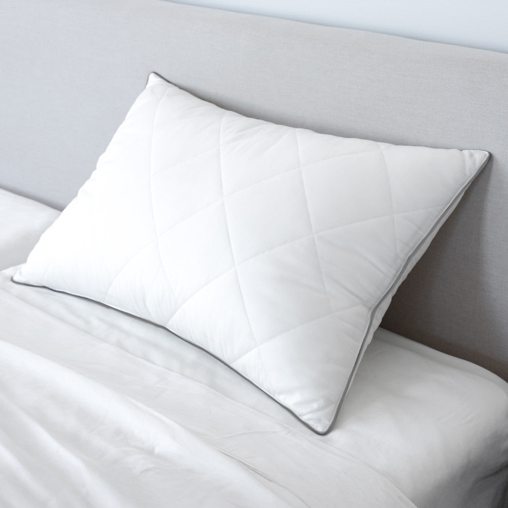 down feather pillow on a bed~Standard