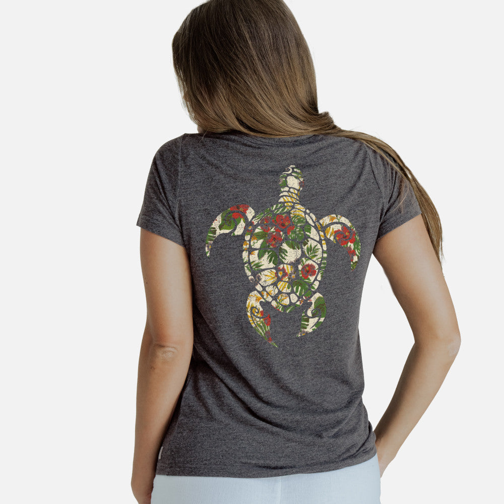back view of model wearing charcoal heather crew tee with our back floral sea turtle