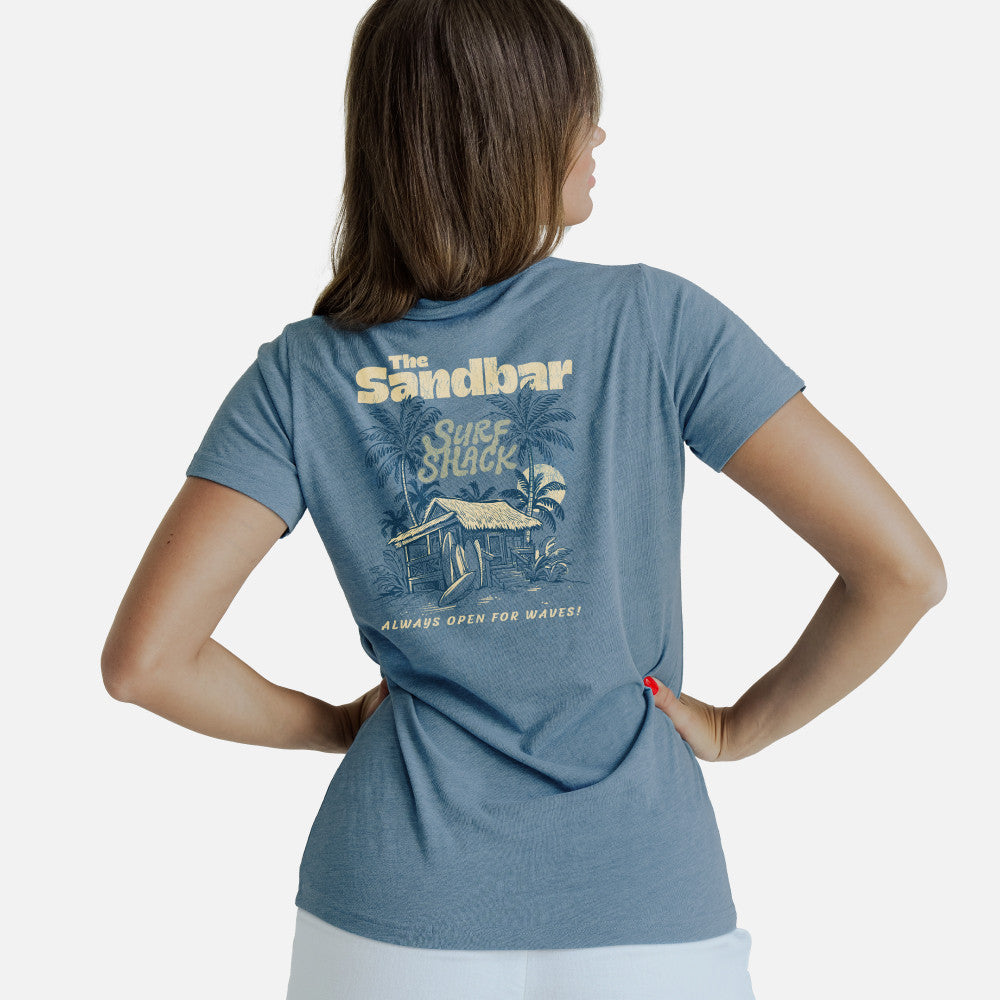 back view of model wearing coastal blue crew tee with our sandbar surf shack back design
