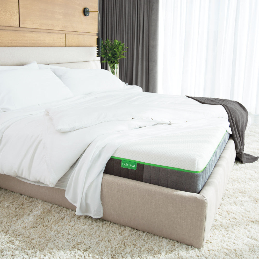 made bed with the corner up showing cariloha mattress~Queen