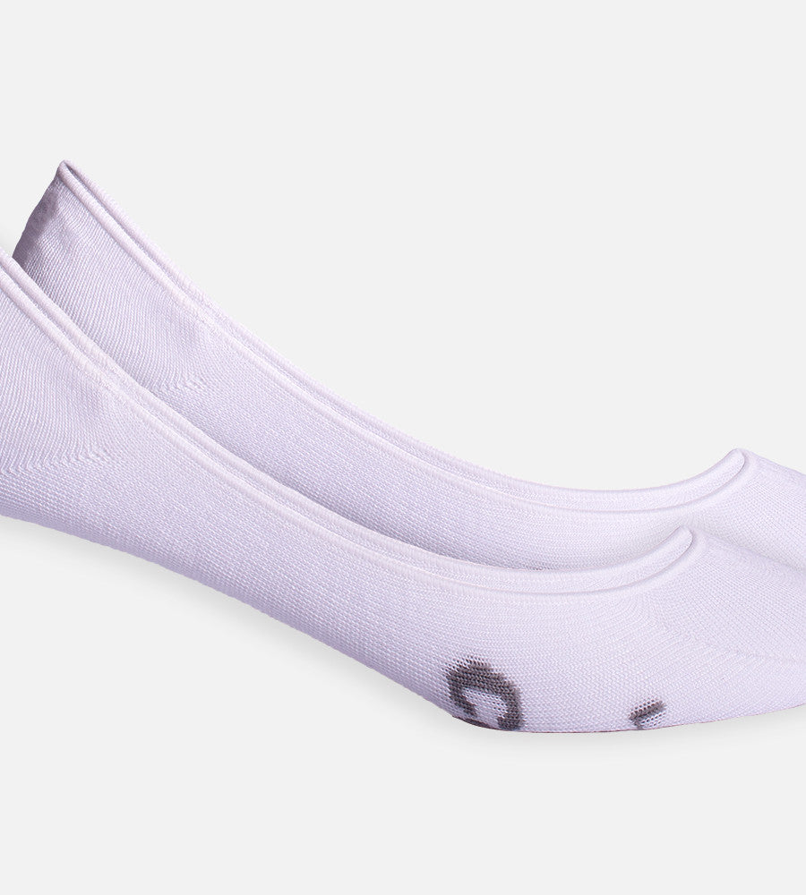 close-up on white no show socks showing the ankle stitching