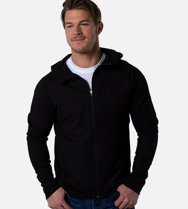 front view of model wearing black zip hoodie