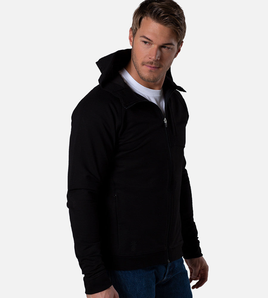 front view of model wearing black zip hoodie with hoodie down
