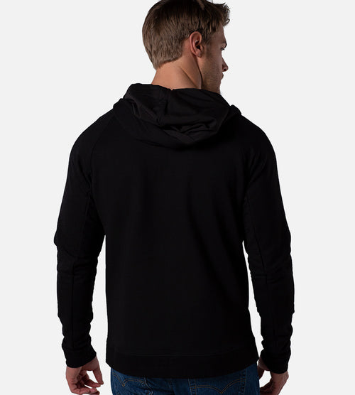 back view of model wearing black zip hoodie