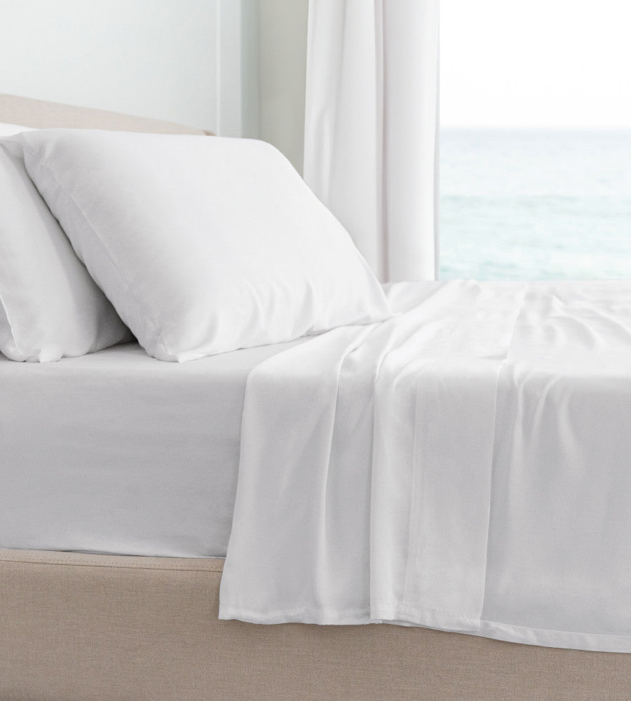 side of bed showcasing white classic sheets