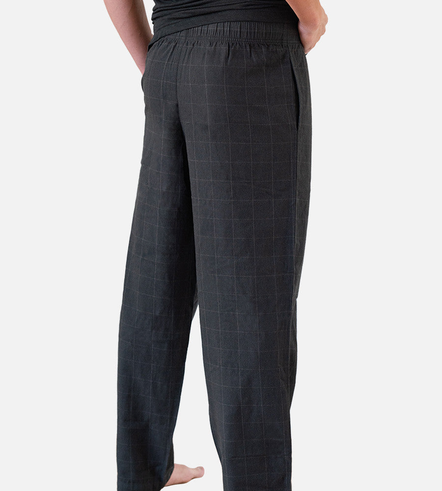 close-up back view of model wearing woven black pants