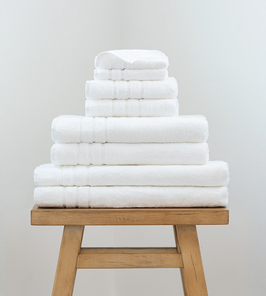 2 bath sheets, 2 bath towels, 2 hand towels and 2 washcloths on a stool