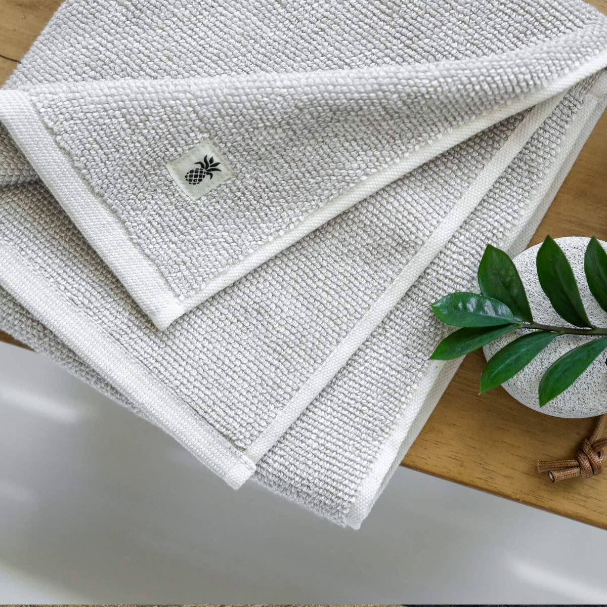 a cariloha two-tone gray towel on a a counter
