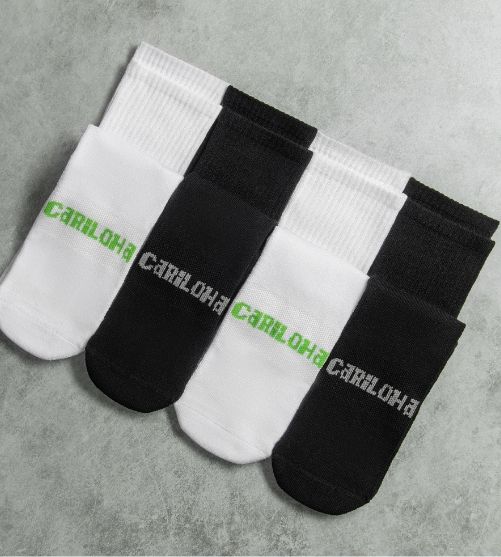 Two pairs of black and two pairs of white Cariloha bamboo crew socks