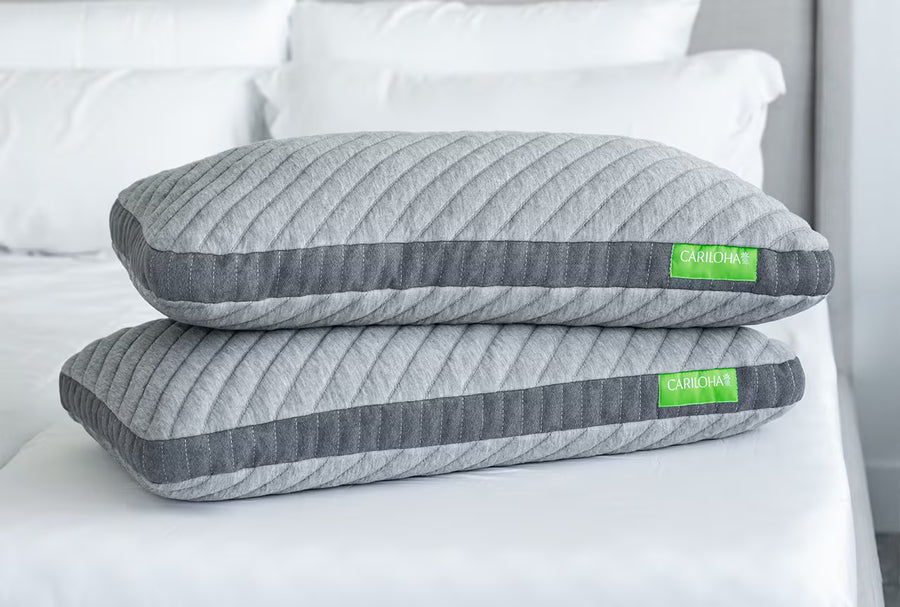 2 cariloha retreat pillows stacked on a bed