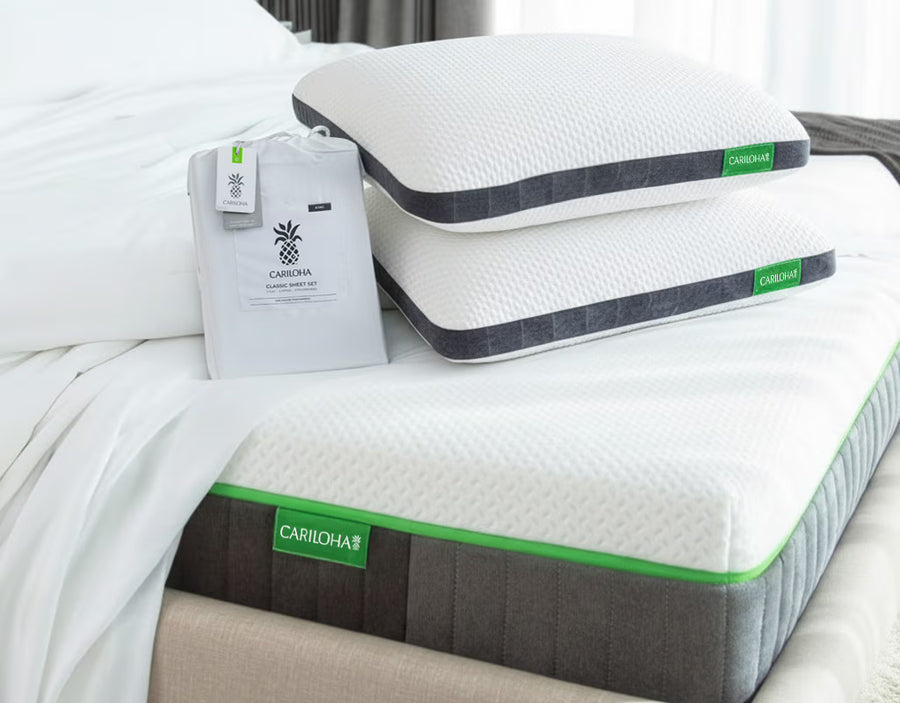 two classic pillows, classic sheets on a cariloha mattress and base.