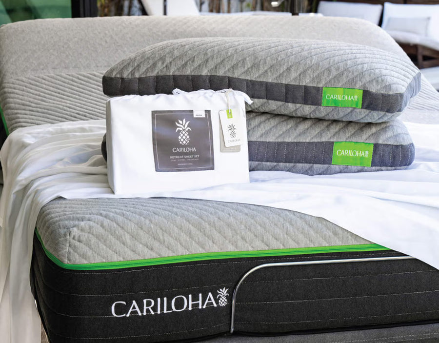 two retreat pillows, retreat sheets on a cariloha mattress and base.