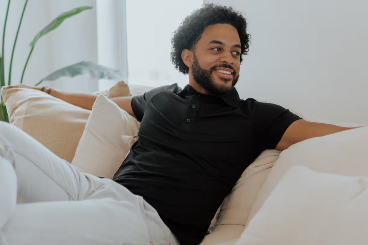 a man wearing a black cariloha polo