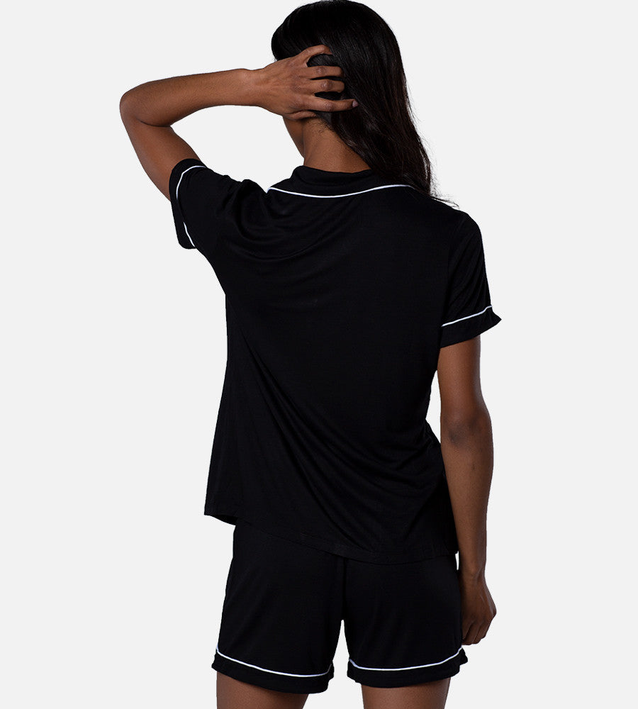 back view of model wearing black short sleep set