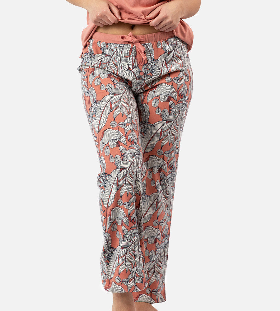 front view of models legs wearing blush foliage print pants