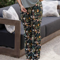 front view of models legs wearing vintage floral print sleep pants