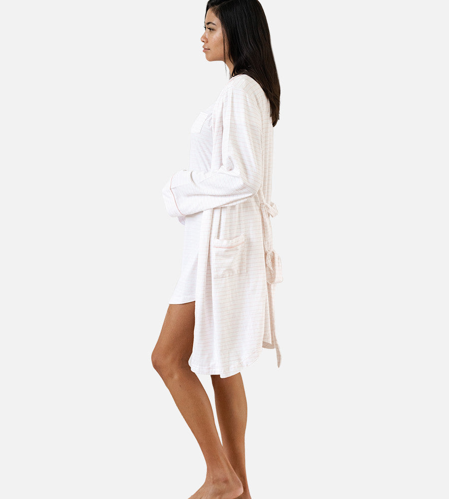 side view of model wearing soft pink robe