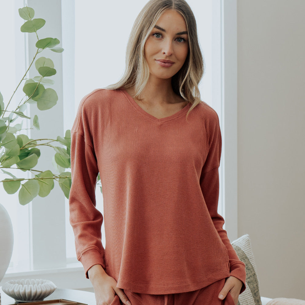 front view of model wearing coral dusk long sleeve