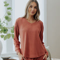 front view of model wearing coral dusk long sleeve