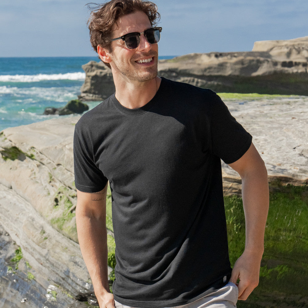 front view of model wearing black crew tee