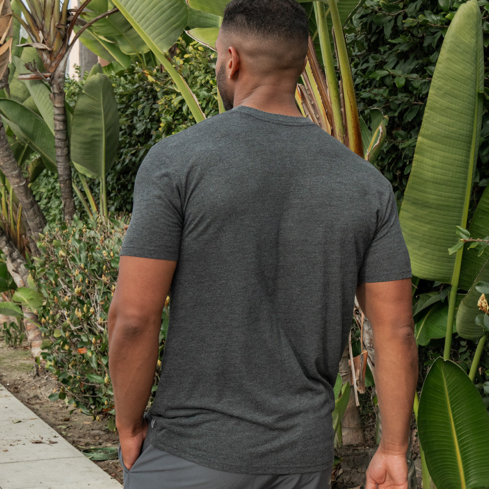 back view of model wearing charcoal heather crew tee