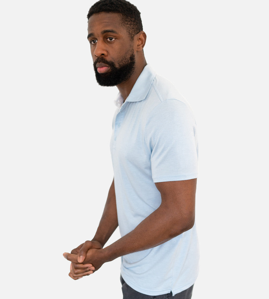 side view of model wearing light blue comfort polo~Light Blue
