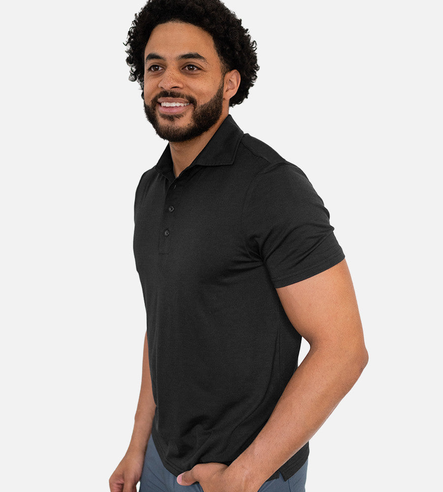 front view of model wearing charcoal comfort polo~Charcoal