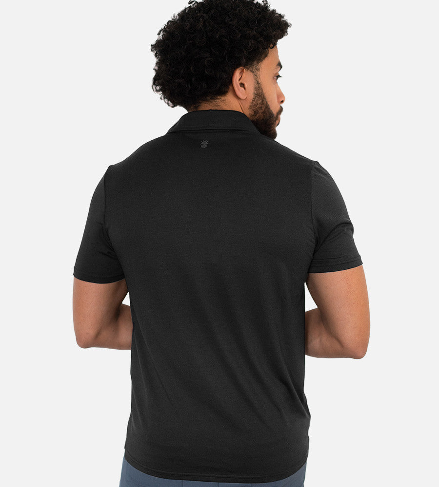 back view of model wearing charcoal comfort polo~Charcoal