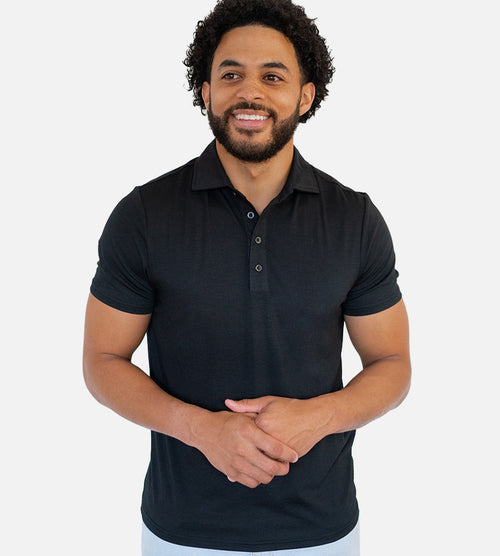 front view of model wearing back comfort polo~Black