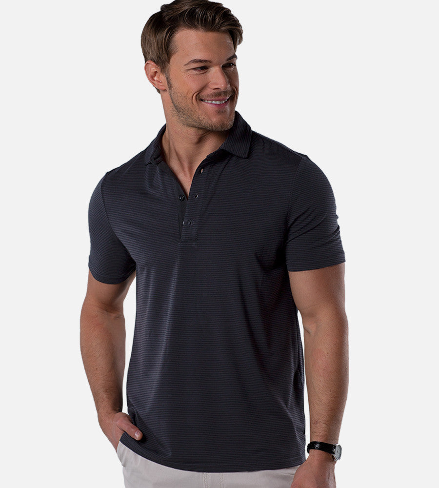 front view of model wearing stripes charcoal/black comfort polo~Stripes Charcoal/Black