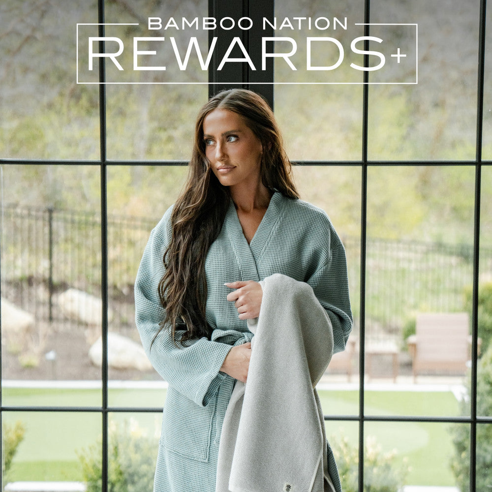 Bamboo Nation Rewards+ A woman wearing a teal waffle knit robe